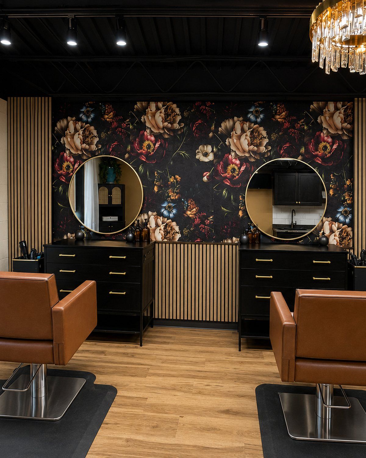 A Von Rae double suite with two cognac styling chairs, dual stations, and floral wallpaper