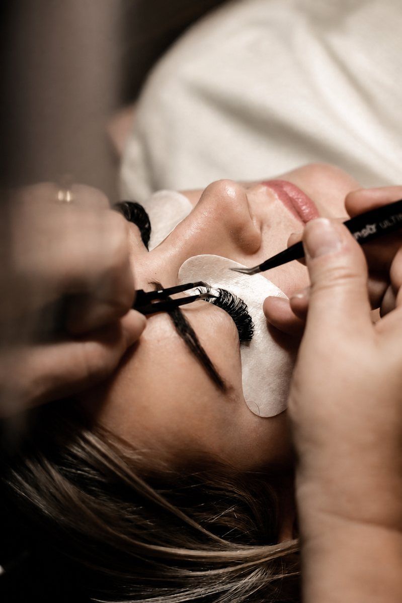A lash artist applying extensions during a service at Von Rae