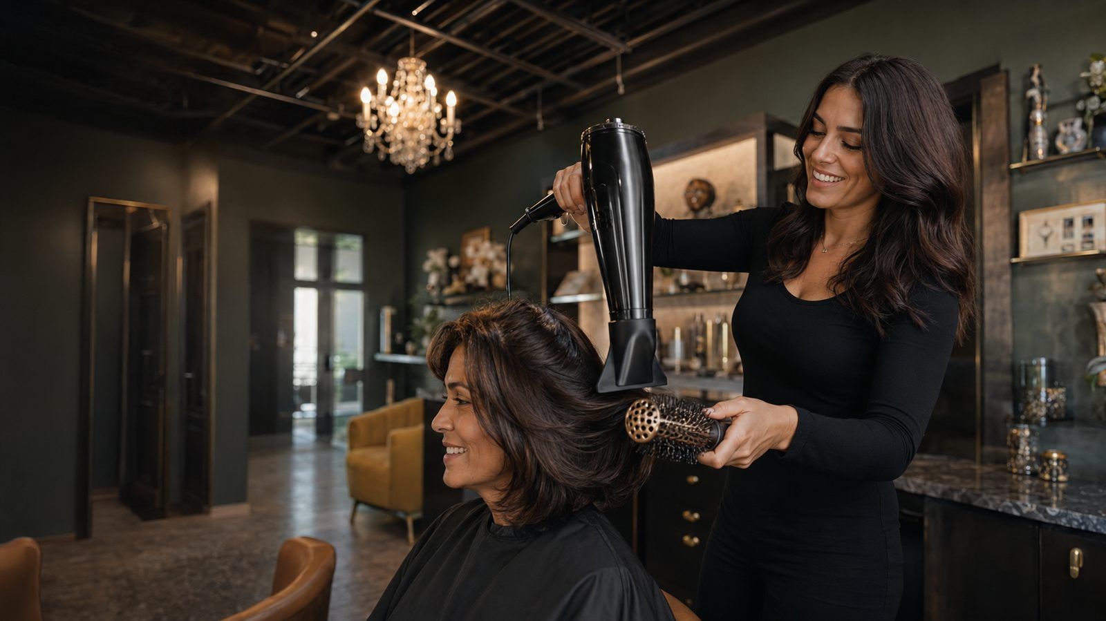 Stylist blow-drying a client's hair inside a Von Rae-style luxury salon